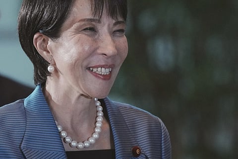 Japan's new Prime Minister Sanae Takaichi arrives at the prime minister's office after being appointed by the parliament, in Tokyo on October 21, 2025.