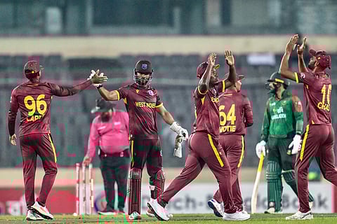 West Indies' players celebrate after winning the Super Over at the end of the second one-day international (ODI) cricket match against Bangladesh at the Sher-e-Bangla National Cricket Stadium in Dhaka on October 21, 2025.
