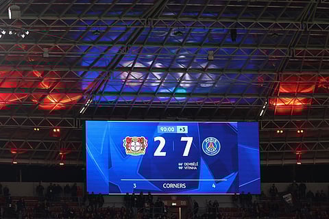 The final score of 2-7 is seen on the scoreboard during the UEFA Champions League football match between Bayer 04 Leverkusen and Paris Saint-Germain (PSG) at the BayArena stadium in Leverkusen, western Germany on October 21, 2025.