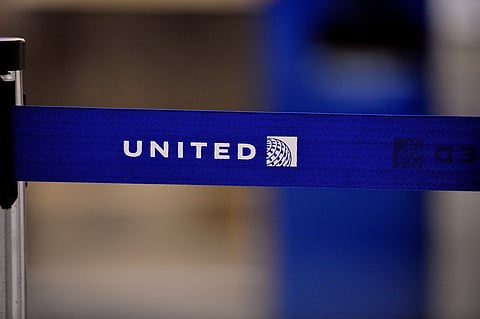 The United Airlines logo can be seen on a rope line at O'Hare International Airport.