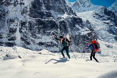 French mountaineers Benjamin Vedrines (L) and Nicolas Jean make their way to the summit of Jannu East, the first ascent of the 7,468 m peak in eastern Nepal.