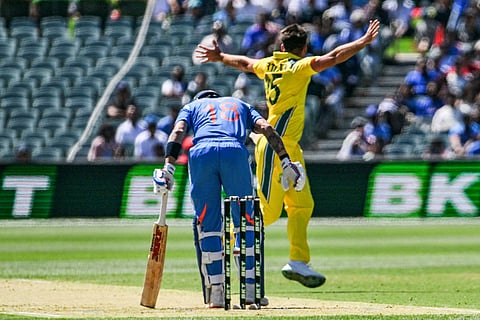 Australia's Xavier Bartlett celebrates taking the wicket of Inadia's Virat Kohli during the second one-day international (ODI) men's cricket match at the Adelaide Oval on October 23, 2025.