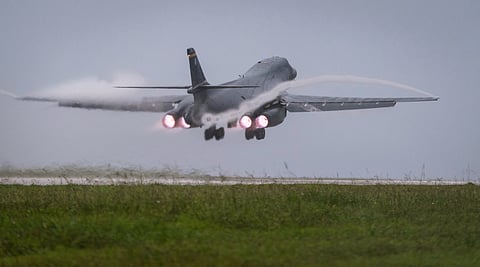 In this file photo released by the U.S. Air Force, a Air Force B-1B Lancer bomber takes off from Andersen Air Force Base, Guam, to fly a mission with two Koku Jieitai (Japan Air Self-Defense Force) F-15s, Sept. 9, 2017.