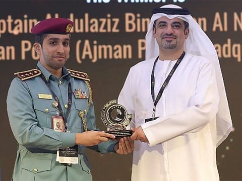 Captain Abdulaziz bin Sultan Al Nuaimi (left) receives the award.