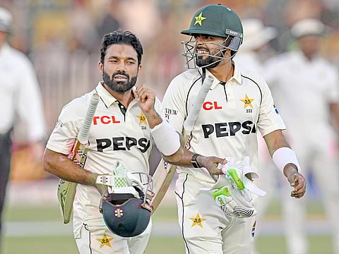 Pakistan's Mohammad Rizwan (L) and Babar Azam