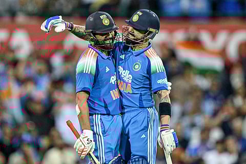 India's Rohit Sharma (L) celebrates with his teammate Virat Kohli after scoring a century during the third ODI against Australia  at the Sydney Cricket Ground in Sydney on October 25, 2025.