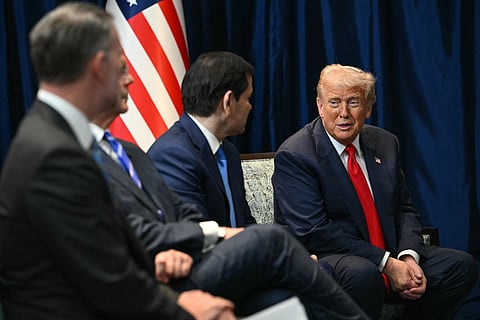 US President Donald Trump (R) talks to US Secretary of State Marco Rubio (2nd R) as they attend a bilateral meeting with Brazil's President Luiz Inacio Lula da Silva on the sidelines of the 47th Association of Southeast Asian Nations (ASEAN) Summit in Kuala Lumpur on October 26, 2025.