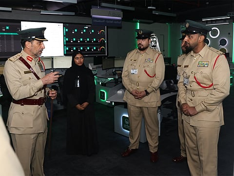 Lieutenant General Abdulla Khalifa Al Marri, Commander-in-Chief of Dubai Police, (left) is seen during an inspection visit to the General Department of Administrative Affairs.