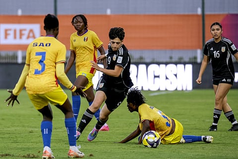 Afghanistan's forward #09 Manozh Noori dribbles past Chad's defender #05 Idriss Haoua during the FIFA Unites Women's Series 2025 match between Afghan Women United and Chad at the Municipal Stadium in Berrechid on October 26, 2025.
