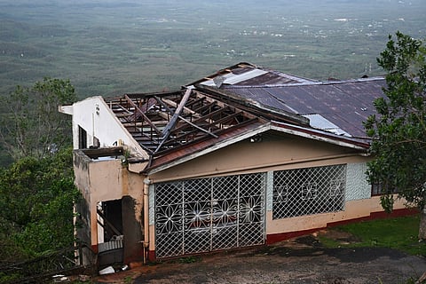 A house with a damaged roof is seen after the passage of Hurricane Melissa in Manchester, Jamaica.