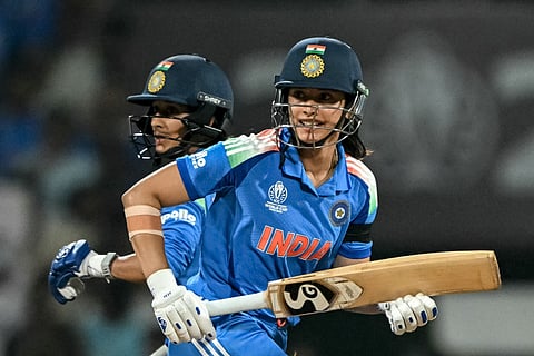 India's Smriti Mandhana (R) and Jemimah Rodrigues run between the wickets during the ICC Women's Cricket World Cup 2025 one-day international (ODI) semi-final match against Australia at the DY Patil Stadium in Navi Mumbai on October 30, 2025.