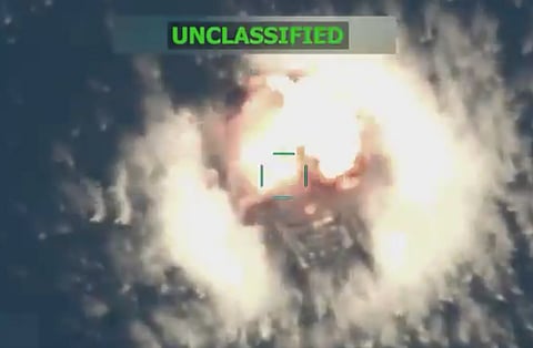 A video accompanying US War Secretary Pete Hegseth's post showed a boat floating stationary in the water before a large explosion and subsequent fire.