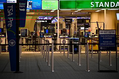 The TSA counter stands empty at Orlando International Airport in Orlando, Florida on October 30, 2025.