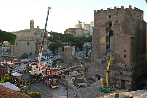 Firefighters work on the site after a part of medieval tower "Torre dei Conti" collapses near the Roman Forum in the historic center of Rome on November 3, 2025.