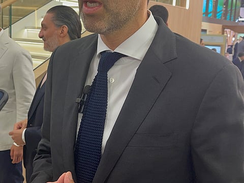 Mansoor Abulhoul, UAE Ambassador to the United Kingdom, speaking to media at the Dubai Pavilion during his visit to the WTM London.