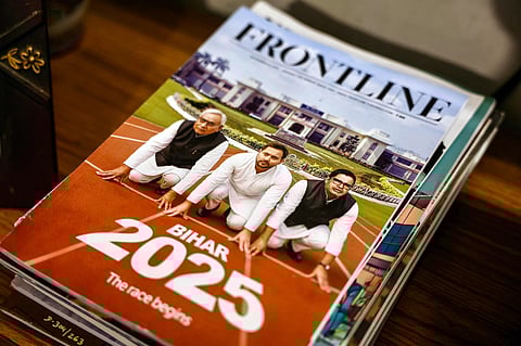 A cover of the Frontline magazine featuring party leaders Nitish Kumar (left), Chief Minister of India's Bihar state and election candidate of Janata Dal United (JDU) party, Tejashwi Yadav (centre), election candidate of Rashtriya Janata Dal (RJD) party and Prashant Kishor, founder of Jan Suraaj party, displayed in Patna, ahead of the state assembly elections.