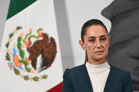 Mexico's President Claudia Sheinbaum gestures during her daily press conference at Palacio Nacional in Mexico City on October 13, 2025 .