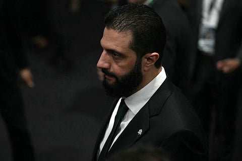 Syria's President Ahmad Al Sharaa walks on arrival at the General Plenary of Leaders in the framework of the COP30 UN Climate Change Conference in Belem, Para State, Brazil, on November 6, 2025.