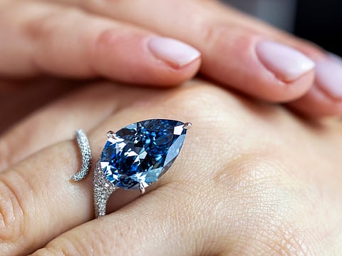 A Christie's employee displays the Mellon Blue at Christie's in Geneva, Switzerland.