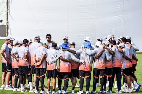 Indian team cuddle up after a training session in Kolkata.