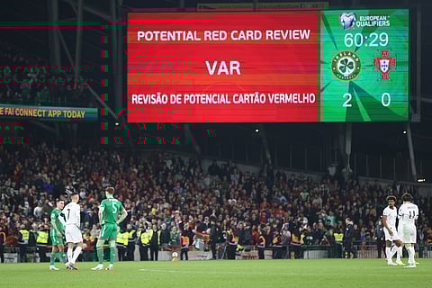 A VAR check on Portugal's Cristiano Ronaldo red card displays the decision was correct during a World Cup 2026 group F qualifying soccer match between Ireland and Portugal in Dublin, Thursday, Nov. 13, 2025. (AP Photo/Peter Morrison)