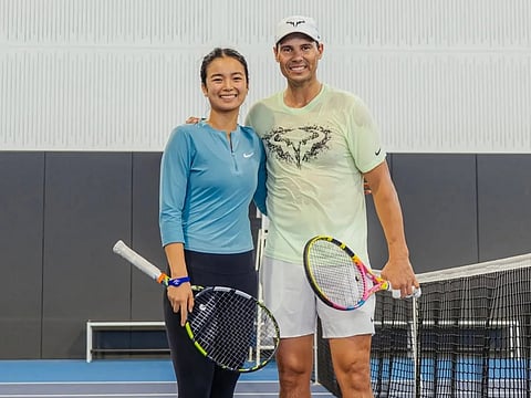 Alex Eala on court with Rafa Nadal.