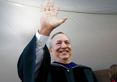 FILE -Former Harvard University president Larry Summers waves during Harvard commencement exercises, May 24, 2018, in Cambridge, Mass.