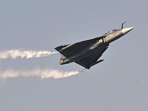 Indian Air Force's HAL Tejas performs is performing a display flight at Al-Maktoum International Airport during the Dubai Airshow 2025 in Dubai on November 20, 2025.