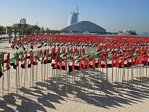 The Flag Garden near Jumeirah Beach displays thousands of UAE flags with the Burj Al Arab rising behind them. Captured by Ilya Ilyinov, the scene reflects the spirit of National Day and the visual unity of the Emirates.
