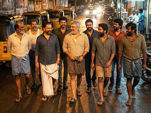 The digitally crafted scene shows Rajinikanth, Kamal Haasan, Ajith, Dhanush, Vijay Sethupathi, Sivakarthikeyan, Suriya, Vijay, and Vikram casually hanging out on a street, reimagined through viral AI visuals.