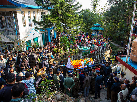 Indian Air Force personnel and relatives carry the casket containing the remains of Wing Commander Namansh Syal, who died in the Tejas plane crash at Dubai Airshow 2025 on Friday, for his final rites at his village near Dharamshala, India, on Sunday, November 23, 2025.