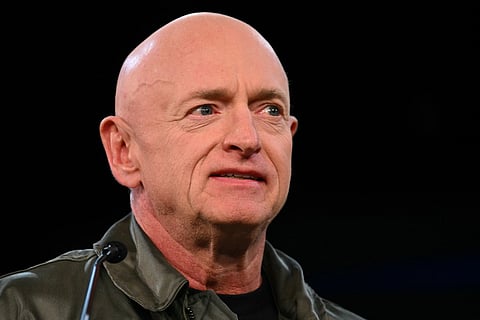 US Senator Mark Kelly, Democrat from Arizona, speaks during the Harris-Walz campaign election eve rally and concert at the Celebrity Theatre in Phoenix, Arizona, on November 4, 2024.