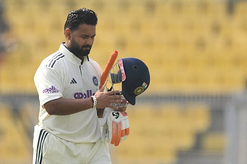 India's captain Rishabh Pant walks back to the pavilion after his dismissal during the third day of the second Test cricket match between India and South Africa at the Barsapara Cricket Stadium in Guwahati on November 24, 2025.