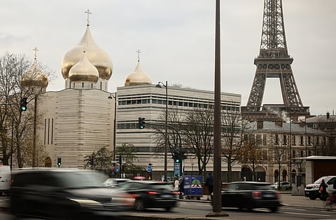 The Holy-Trinity Russian orthodox Cathedral and the adjoining culture center, right, are seen next to the Eiffel Tower in Paris, Wednesday, Nov. 26, 2025.
