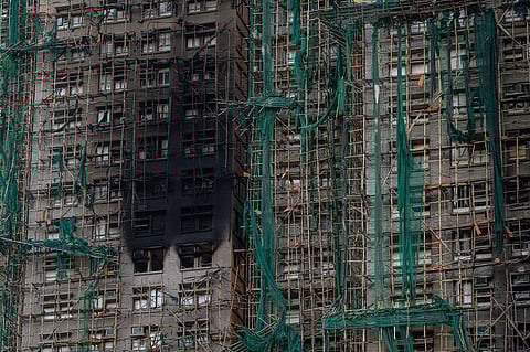 Burned buildings are seen at the scene of the fire that started Wednesday at Wang Fuk Court, a residential estate in the Tai Po district of Hong Kong's New Territories, Friday, Nov. 28, 2025.