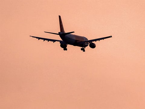 File photo: An Airbus A320 aircraft of Iranian airline Qeshm Air flies over Shamiya district on its landing approach to Najaf International Airport in central Iraq.