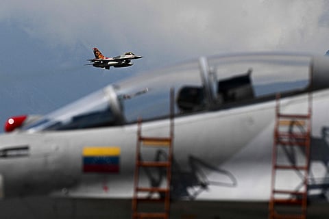A Venezuelan air force US-made F-16 aircraft overflies during the 2025 Venezuela industrial aviation expo at the Libertador Air Base in Maracay, Aragua State, Venezuela, on November 29, 2025.