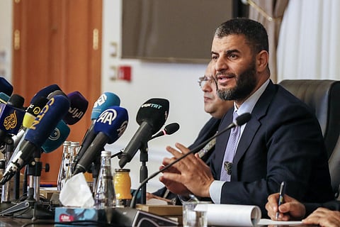 Libya’s acting interior minister, Imad al-Trabelsi, speaks during a conference on immigration and voluntary return programmes, attended by foreign ambassadors and representatives of international organizations, at the Interior Ministry headquarters on Airport Road in the capital Tripoli on December 2, 2025.