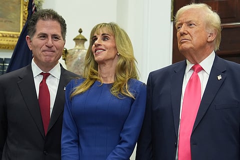 Michael Dell, left, his wife Susan and President Donald Trump listen during an event on "Trump Accounts" for kids in the Roosevelt Room of the White House, Tuesday, Dec. 2, 2025, in Washington.