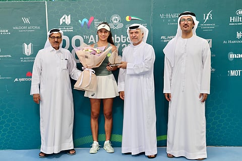 Al Habtoor Tennis Challenge champion Petra Marcinko receives the trophy from Khalaf Al Habtoor, Ahmed Abdul Malik and Nasser Al Marzooki of the UAE Tennis Federation.