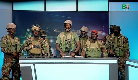 This videograb taken from handout footage released by Benin TV on December 7, 2025, shows soldiers from the "Military Committee for Refoundation" (CMR), appearing on state television in Cotonou, after a reported attempted coup in the West African nation.