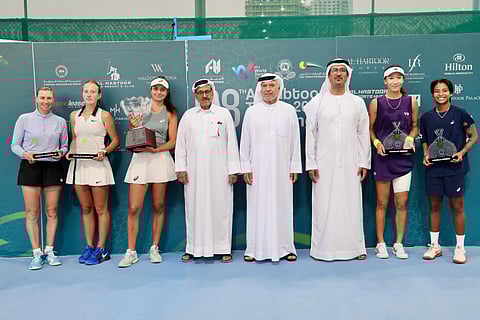 Winners with the officials at Al Habtoor Tennis