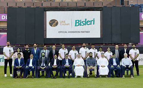 Players, men’s and women’s teams head coaches and dignitaries from the ECB and Bisleri pose at the Dubai International Stadium.