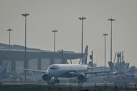 An IndiGo Airlines aircraft prepares to take off at Kempegowda International Airport on a hazy day in Bengaluru on December 9, 2025.