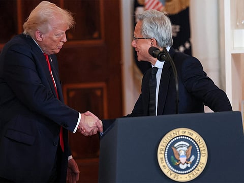 Nvidia CEO Jensen Huang and US President Donald Trump shake hands.