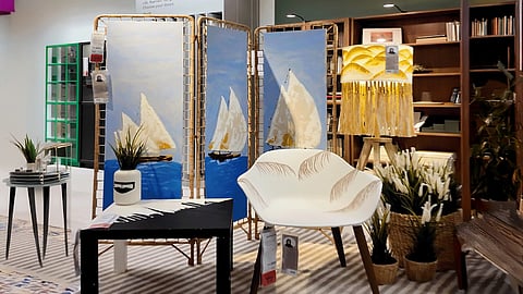 Muhra Al Muhairi has given an Emirati twist to IKEA's STILREN Vase, LAUTERS Floor Lamp, GRÖNSTA Chair with Arm rests, LACK Side Table, and TOLKNING Room Divider