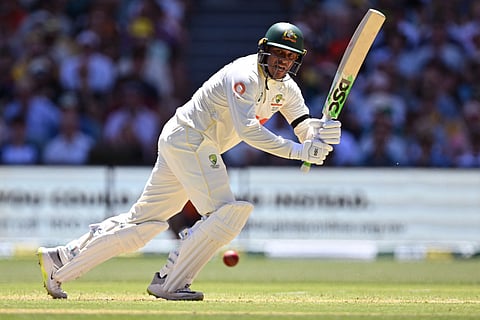Australia's Usman Khawaja plays a shot on the first day of the third Ashes cricket Test match between Australia and England at the Adelaide Oval in Adelaide on December 17, 2025.