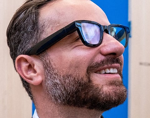 An attendee tries out a prototype of the Android XR glasses, equipped with Gemini AI during Google's annual I/O developers conference in Mountain View, California on May 20, 2025.