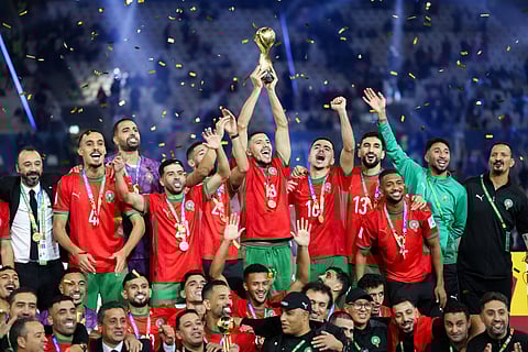 Morroco's players celebrate with the trophy after winning the FIFA Arab Cup 2025 final football match between Jordan and Morocco at the Lusail Stadium Stadium, in Lusail on December 18, 2025.
