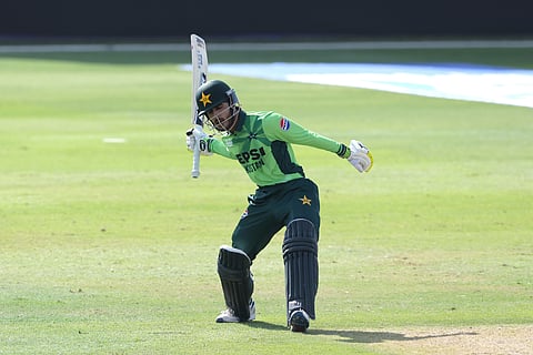 Pakistan batter Sameer Minhas celebrates his century.